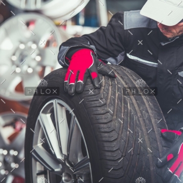 demo-attachment-241-replacing-car-tires-F6SZJYW